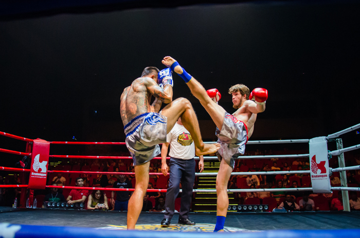 Muay Thai fight taking place in a ring