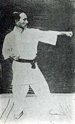 This is an old photograph of Gichin Funakoshi the founder of Shotokan Karate