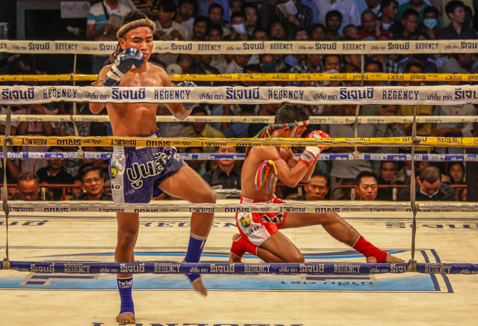 Muay Thai fighters doing the Wai Kru in the ring before the fight
