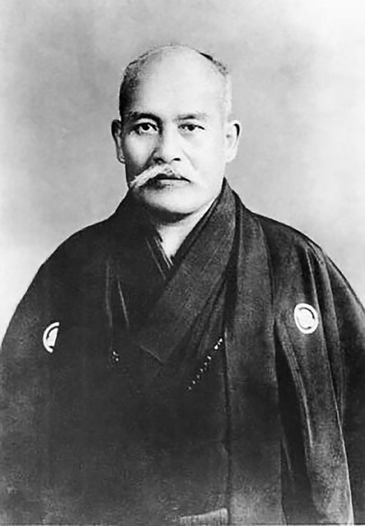 This is a portrait photograph of Morihei Ueshiba, the founder of Aikido