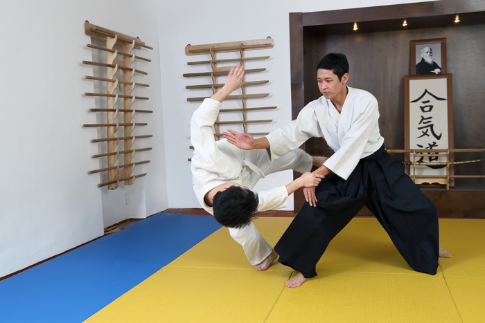 This is an Aikido practitioner performing a throw