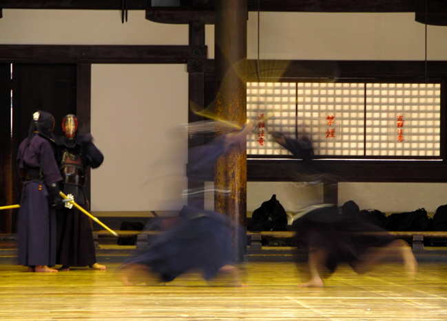 Kendo dojo with two Kendokas sparring