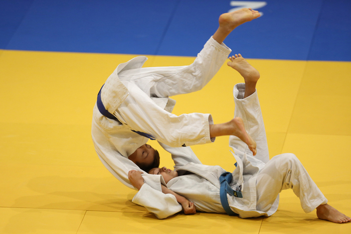 This is a Judo ground technique in a competition, this is known as Ne-Waza in Judo