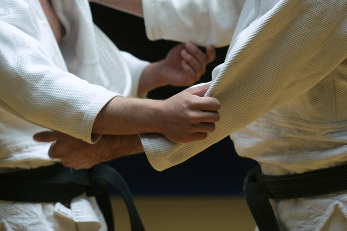 Close up of Judo practitioners wearing the gi