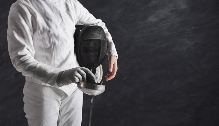 This is an image of a fencer dressed in fencing gear