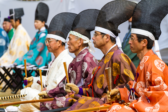 Kyudoka in a line holding their yumi bow