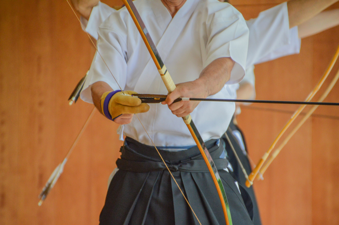 A Kyudoka holding the yumi bow