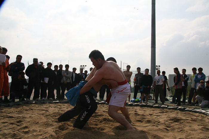 This is a photo of Ssireum wrestlers grappling in a match