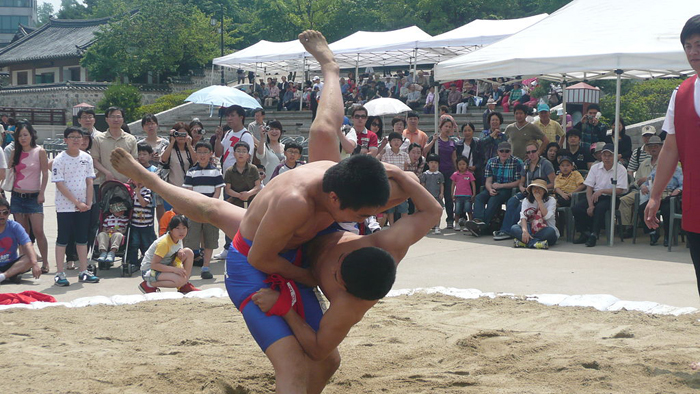 Ssireum wrestlers competing in a match