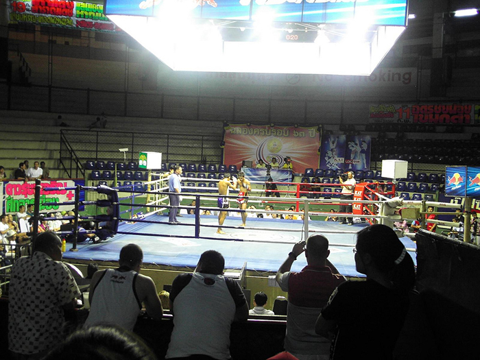 View of the boxing ring with a fight taking place at Rajadamnern Stadium