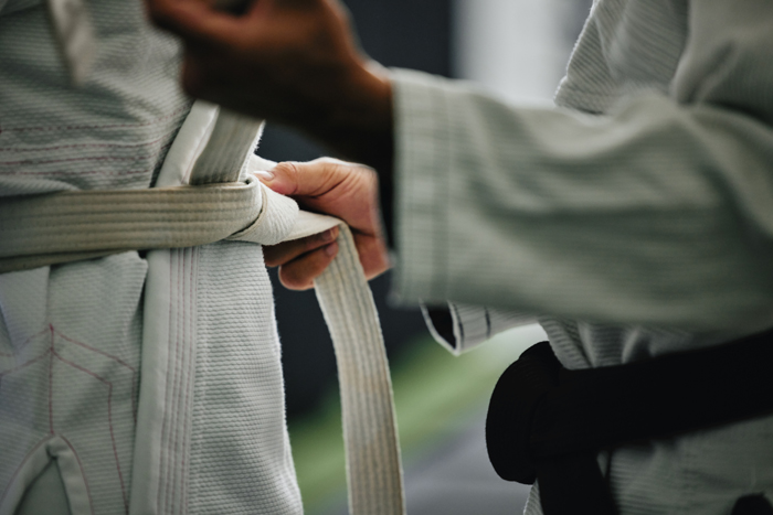 Karate belts being tied
