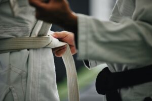 Karate students tying their belts, karate is a popular Japan martial art