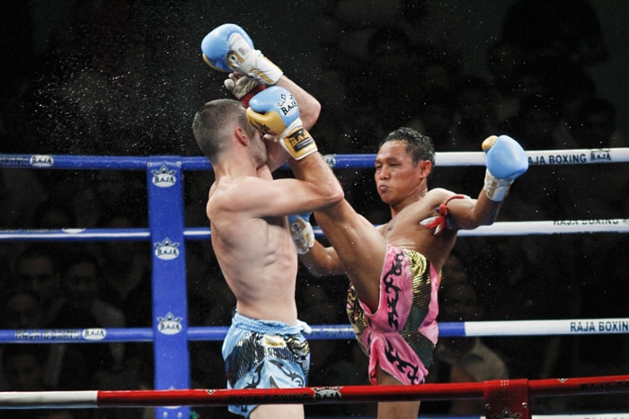 Muay Thai is a very popular striking martial art and this is a photograph of a famous Muay Thai fighter competing against an opponent