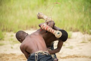 Two Dambe fighters missing their punches during a fight