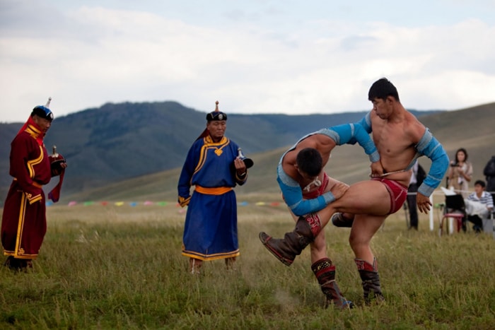 Mongolian wrestlers in the middle of a match