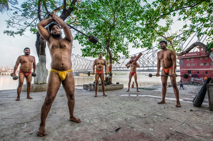 Indian mud wrestler training at an outdoor gym